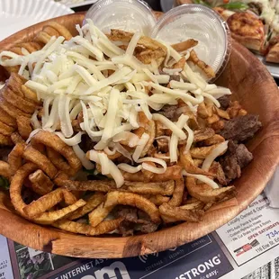 Steak salad with curly fries and ranch dressing