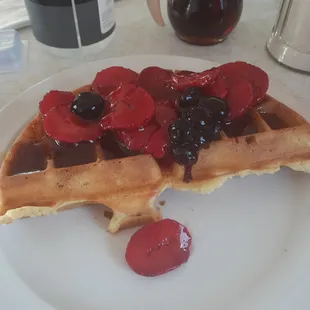 Half a waffle with fruit topping