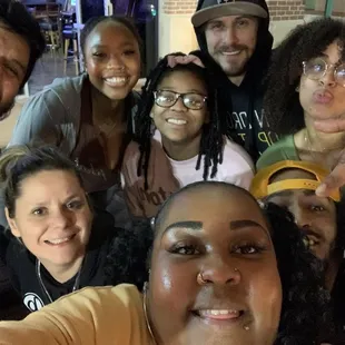 a group of people posing for a selfie