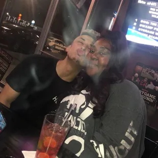 a man and a woman sitting at a table