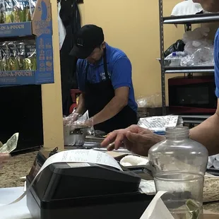 a man and a woman preparing food