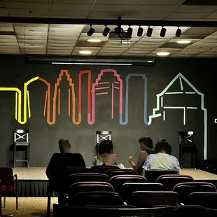 people sitting in front of a stage