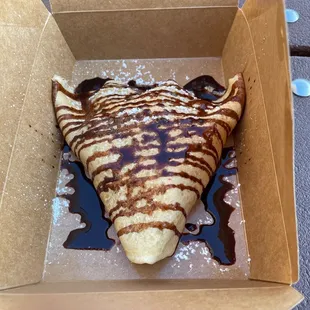 Nutella and strawberry crepe with chocolate sauce