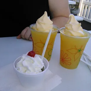 Our original order kids scoop with whip cream and cherry. I asked for hot fudge never got it :/ also pictured is out two dole whip drinks