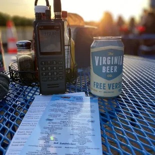 a drink and a menu on a table