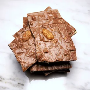 almonds on top of a chocolate bar
