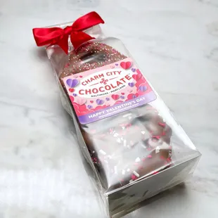 a bag of chocolate covered donuts