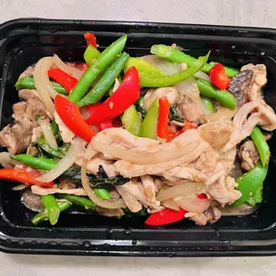 chicken and vegetables in a black container