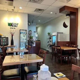 a restaurant with tables and chairs