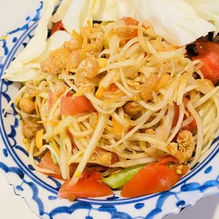 a blue and white plate of food