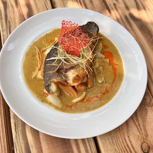 a plate of food on a wooden table