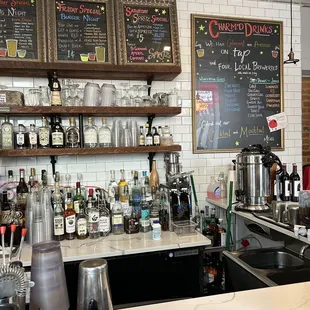 a bar with a variety of drinks