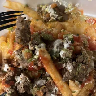 Carne Asada Fries ... that looks like ground beef not cooked Al the way.