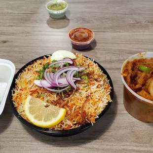 Middle is #53. Left is an appetizer. Right is goat something w/o the rice