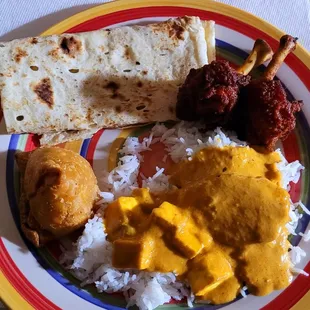 Rectangular! naan, chicken lollipops, butter chicken, mutter paneer, rice, and a really good samosa.