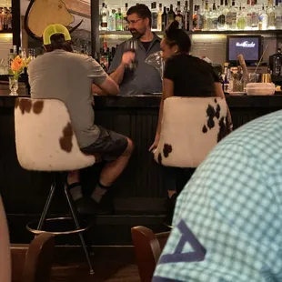 people sitting at a bar