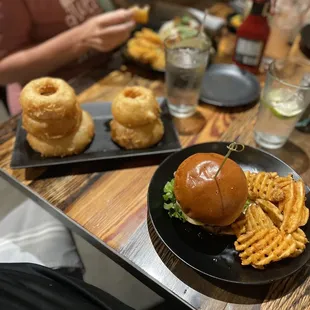 Onion rings and the maple bacon burger.