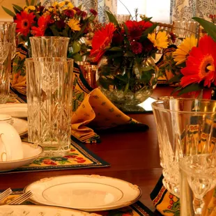 Fresh flowers, fine china and crystal grace the dining room tables.