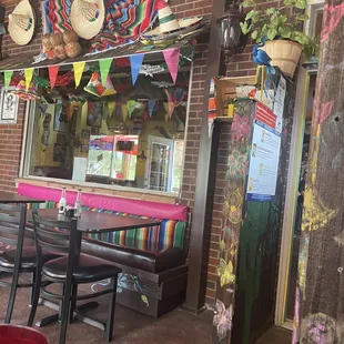a restaurant with tables and chairs