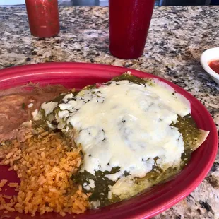 Chicken enchiladas with rice and beans, salsa on side