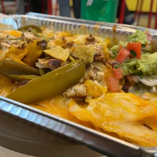 a tray of nachos and guacamole