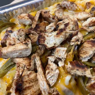 chicken and peppers in a pan