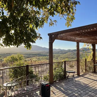 a patio with a view of the mountains