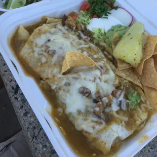 This is a wet chili verde burrito. My friend recommended it. It's so good, cheese on point, and the meat was really tender.