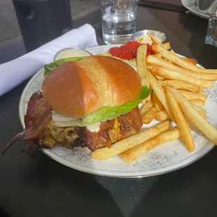 Bacon burger with fries.