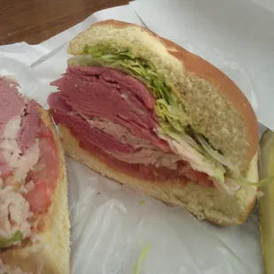Josepi (corned beef, turkey, and salami) with a soft roll, Other bread options are available.