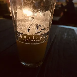 a glass of beer on a table