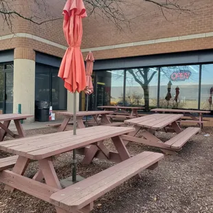picnic tables and umbrellas outside
