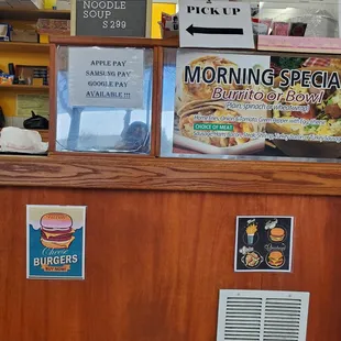 a counter with a menu on it
