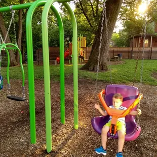 #purple&amp;orangeswing with the #junglegym in the back ground @chase&amp;Ferguschildrenspark @norhside @yelpcincy