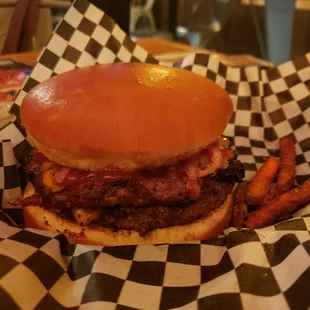 a burger and fries in a basket