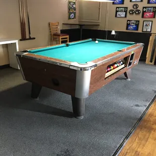a pool table in a game room