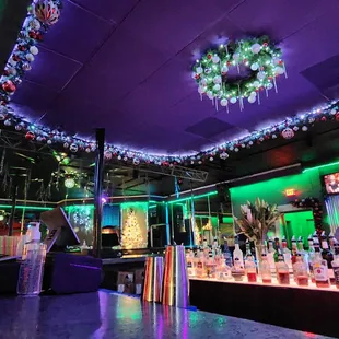 a bar decorated with christmas lights