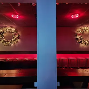 a christmas wreath on the ceiling of a restaurant