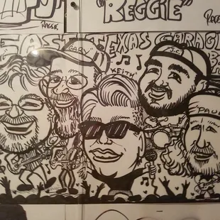 a drawing of a group of people on a wall