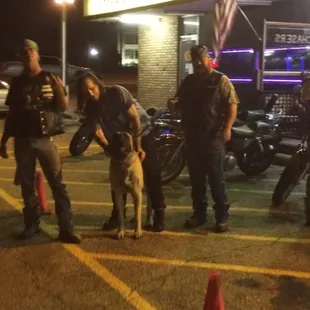Zander in front of my favorite bar Chasers he love to go to Chasers and hang on the front porch and take pictures we all his biker buddy's
