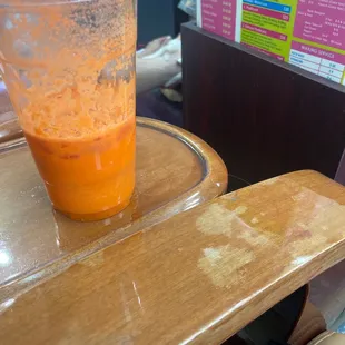 a plastic cup on a wooden table
