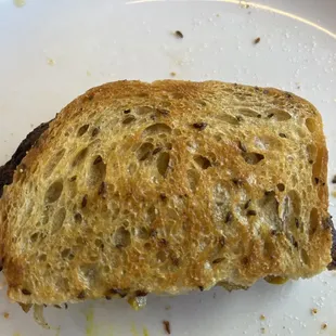 Half of Patty Melt with perfectly grilled bread.