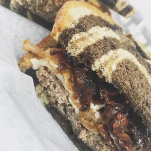 Hop Shop Patty Melt with Swiss cheese, bacon jam, crispy fried onions between Toasted Marble Rye.