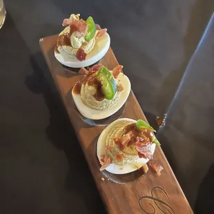Deviled eggs..a bit tangy. Half order is 3. They should even the quantity to 4...what&apos;s wrong with just adding the other half?