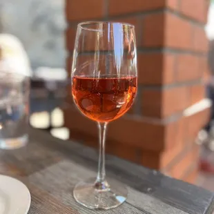 a glass of rose wine
