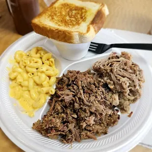 Two meat plate: chopped brisket, pulled pork, Mac and cheese and potato salad