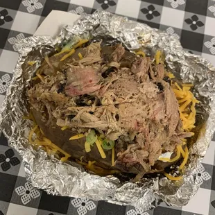 One meat baked potato (pulled pork loaded)