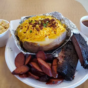 1 meat tator (asked for meat on side) and 1 meat rib kids meal put all on one plate. Kids come with a drink and a side (zesty mac salad).