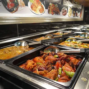 a variety of food in a buffet