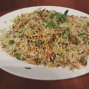 a plate of rice and vegetables